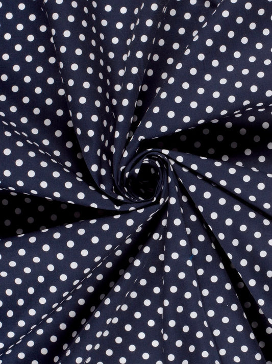 Popeline de coton bleu marine imprimé pois blanc